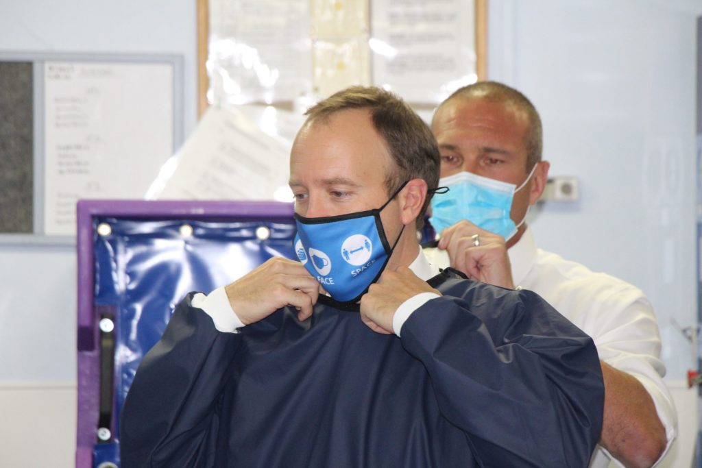 Matt Hancock puts on a gown.