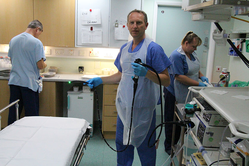 endoscopy team prep the procedure room