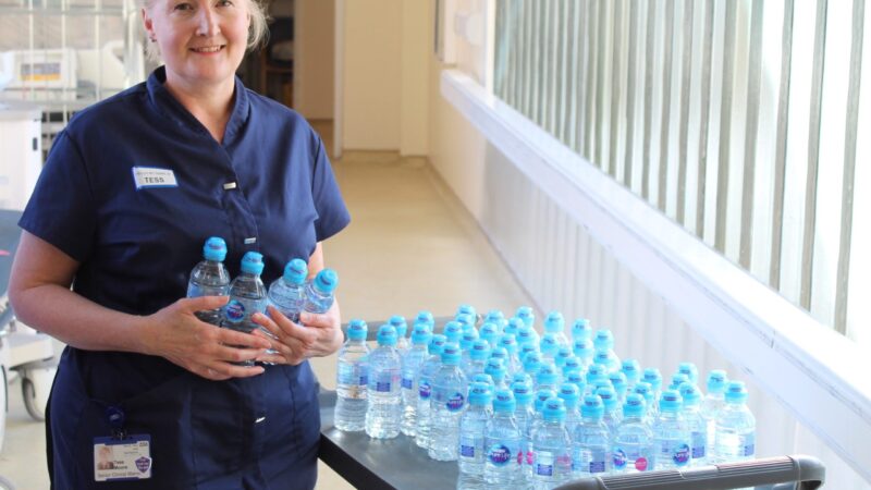 Tess Moore with the water bottle donation