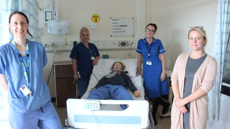 The new manikin with some of our Trust staff