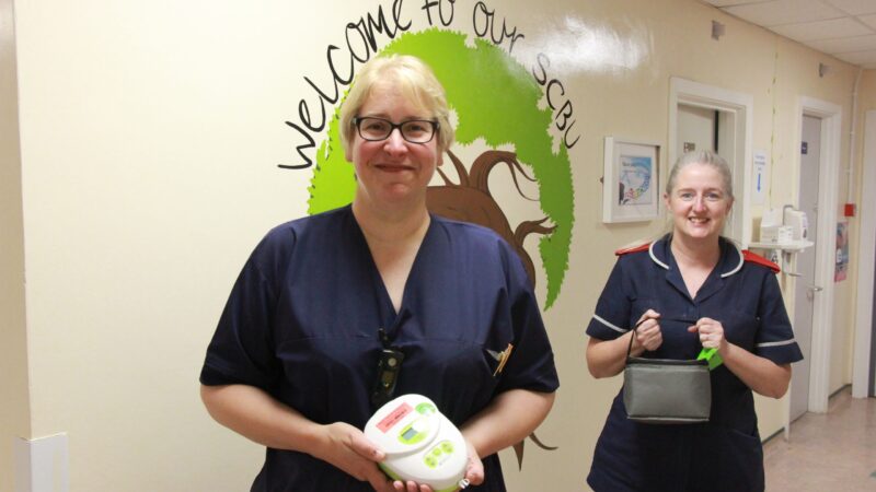 Staff on the special care baby unit holding breast pumps.