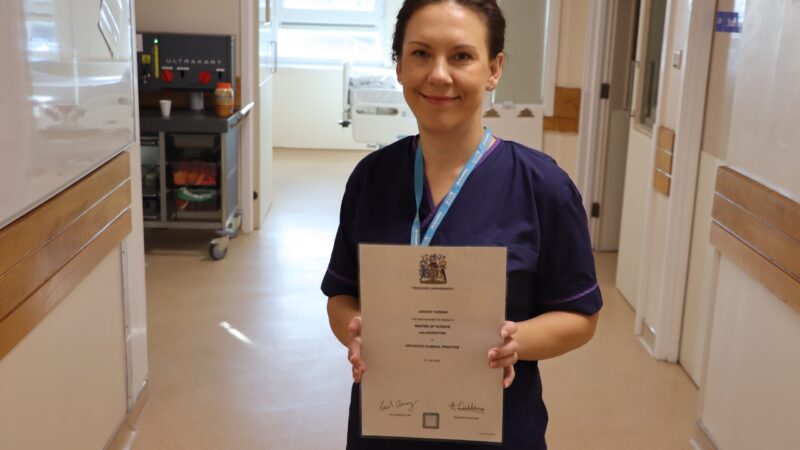Gillian Waddleton holding her certificate.