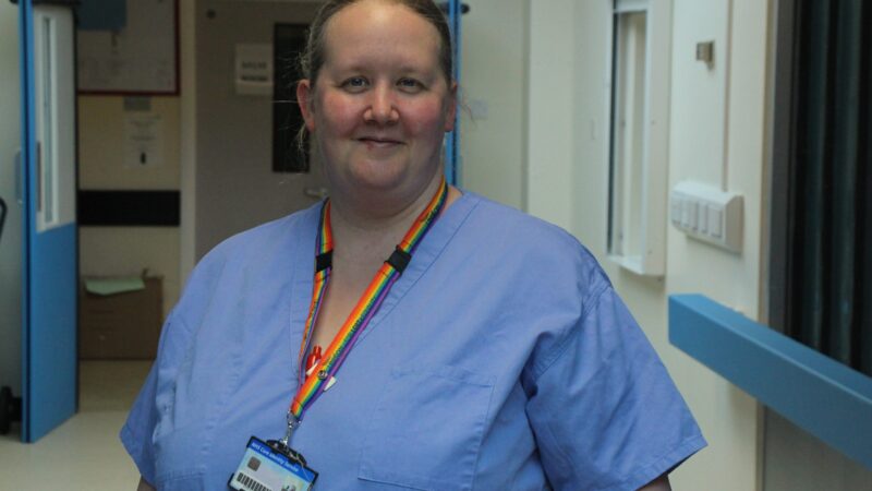 Jennifer Chubb in blue scrubs.