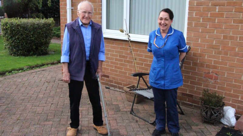 Tom and podiatrist Melanie outside Tom's home.