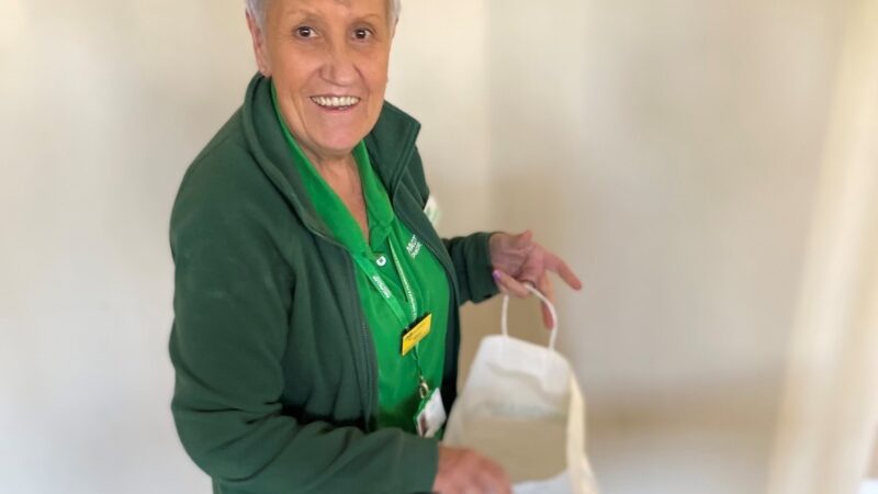 Alison Parsons holds an information pack.