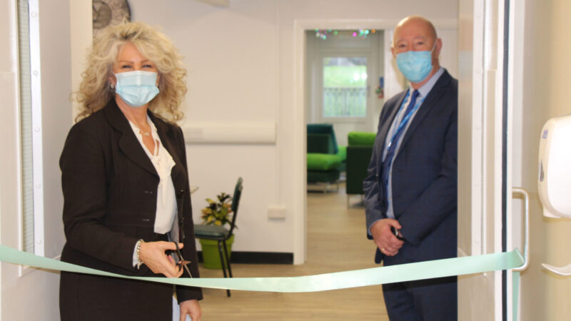 Julie Gillon cuts a ribbon to the North Tees Rainbow Room.