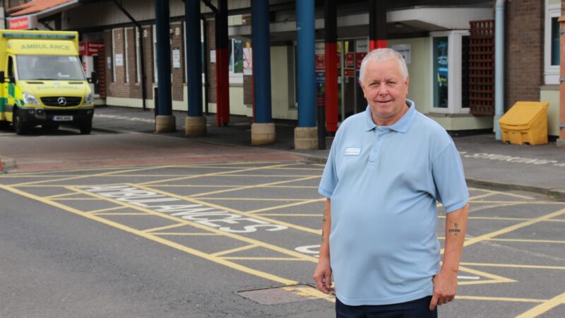 Dicky Peacock stands outside the University Hospital of North Tees.